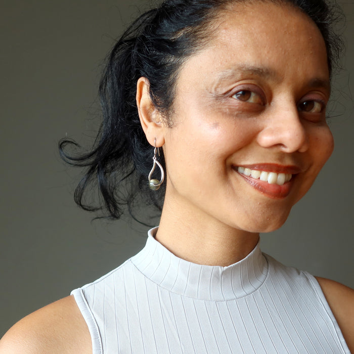 woman modeling labradorite earrings