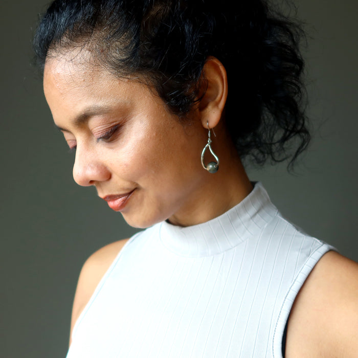 woman modeling labradorite earrings