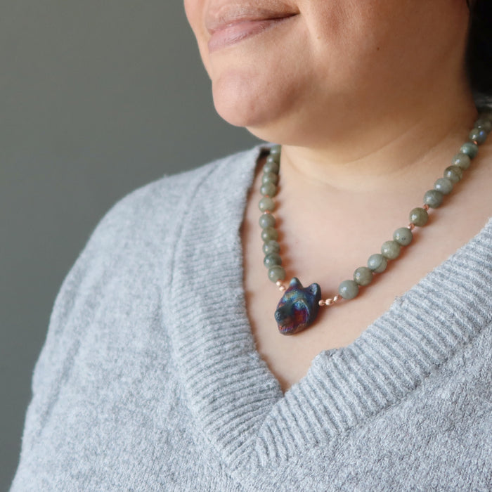 female model wearing labradorite wolf necklace