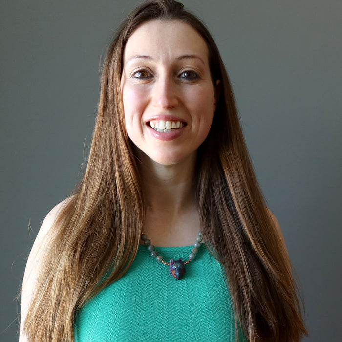 female model wearing labradorite wolf necklace