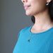 sheila of satin crystals wearing faceted labradorite crescent moon gold chain necklace