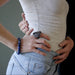 woman with hand on hips wearing lapis lazuli stretch bracelet and large dendritic agate ring