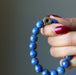win 9mm luger bullet inscription beaded on a lapis stretch bracelet