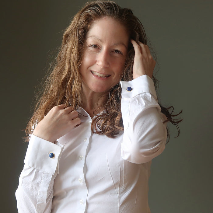 woman wearing lapis gold cufflinks