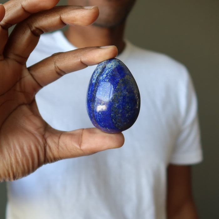 man holding lapis egg