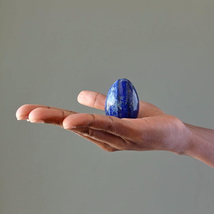hand holding lapis egg