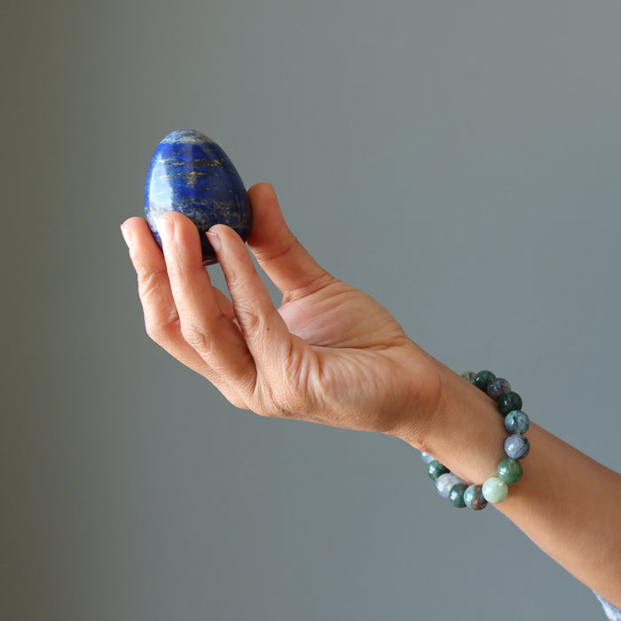 hand holding lapis egg