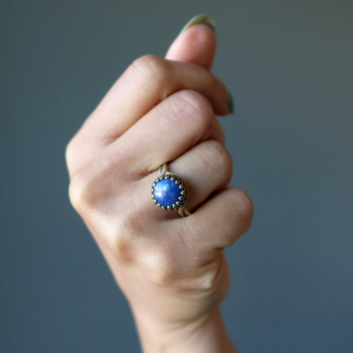 lapis antique brass ring on ring finger