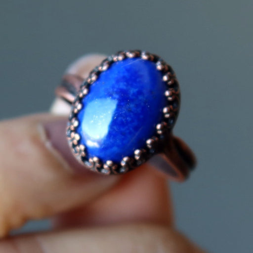 hand holding lapis ring