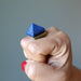 hand wearing lapis pyramid ring