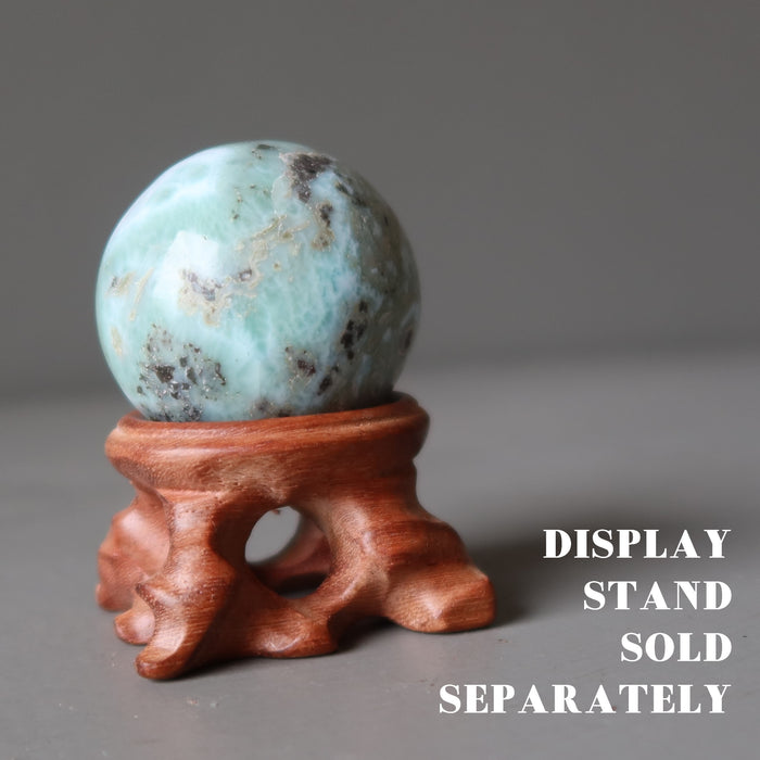 larimar crystal ball on wood display stand