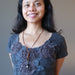 woman wearing lava howlite necklace