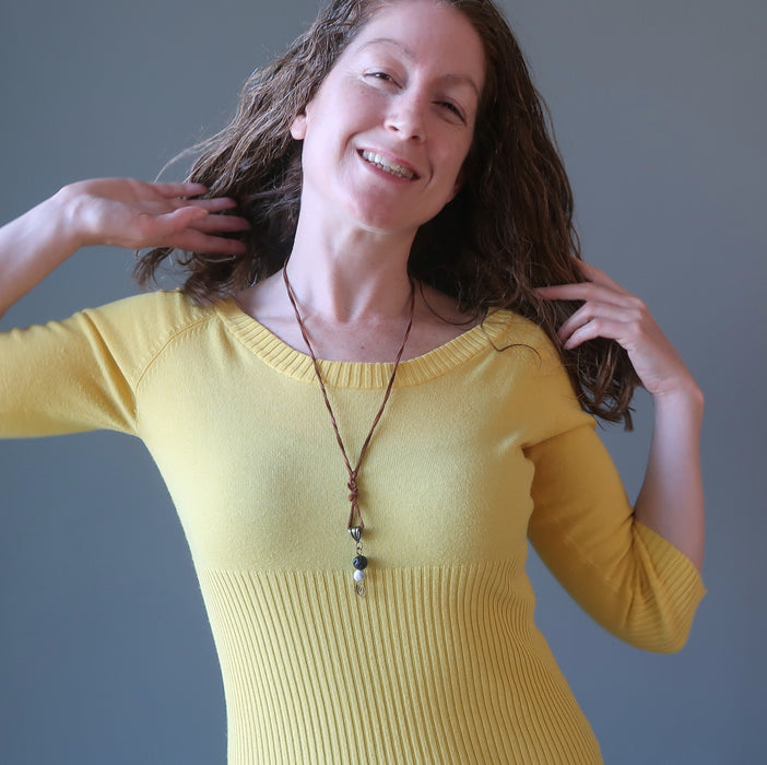 woman wearing lava howlite necklace