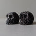 black lava skulls