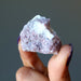 raw lepidolite stone in white quartz