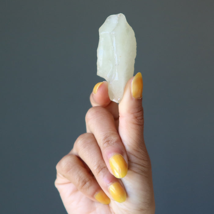 hand holding libyan desert glass