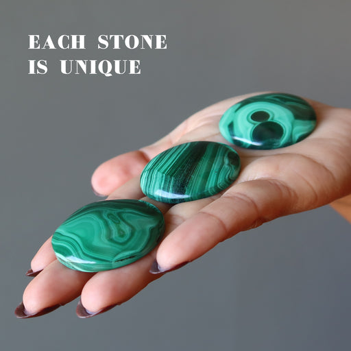three malachite round cabochons