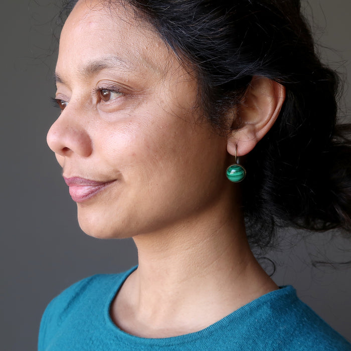 sheila of satin crystals wearing malachite bronze leverback earrings 