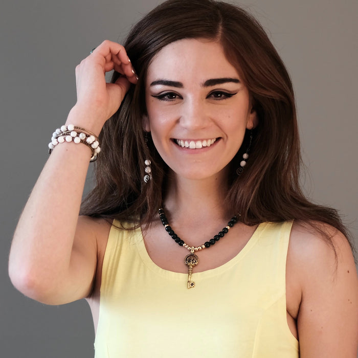 model wearing ganesh skeleton key malachite necklace