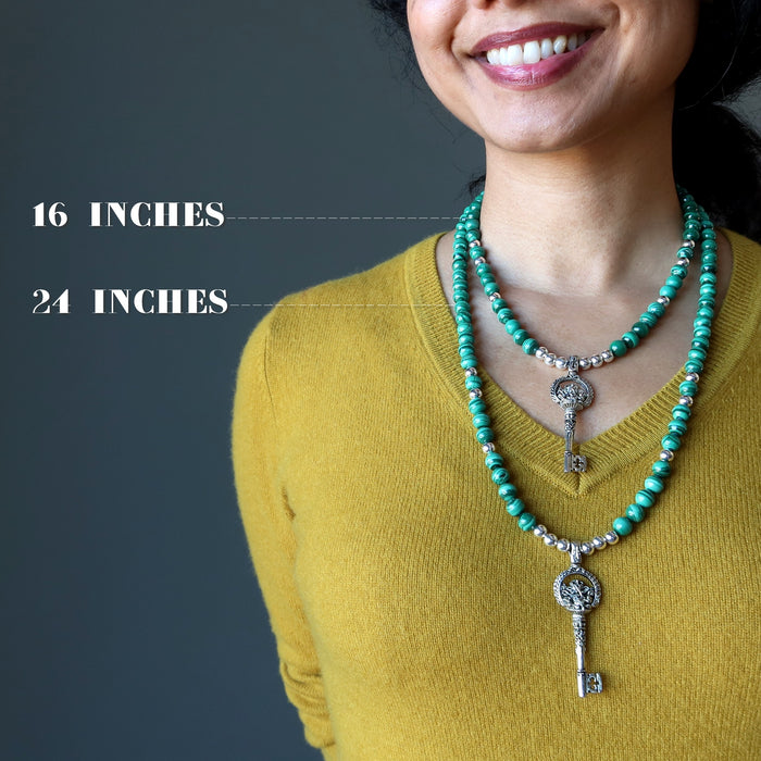 woman wearing silver ganesh skeleton key malachite necklaces