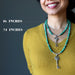 woman wearing silver ganesh skeleton key malachite necklaces