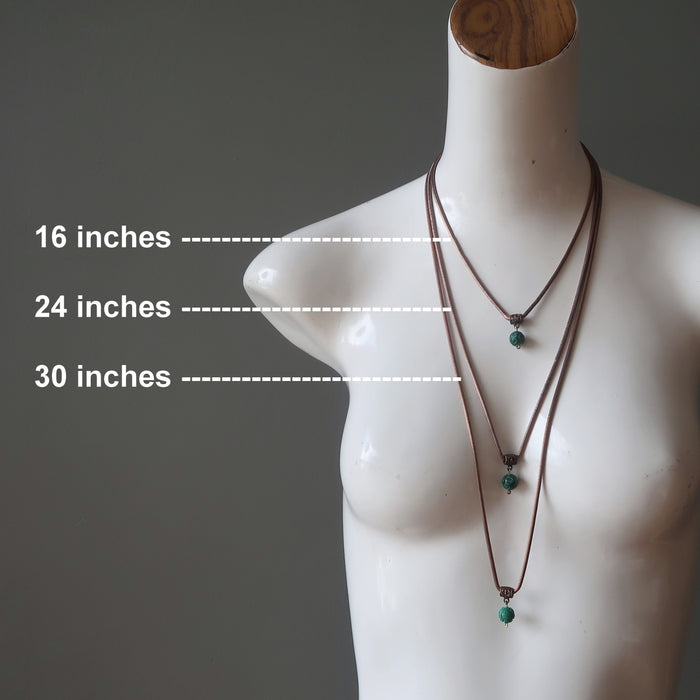 layer of malachite necklaces in different lengths