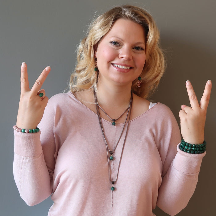 model wearing malachite jewelry