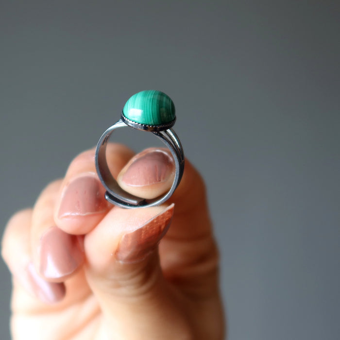 hand holding malachite ring 