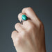 hand wearing malachite ring 