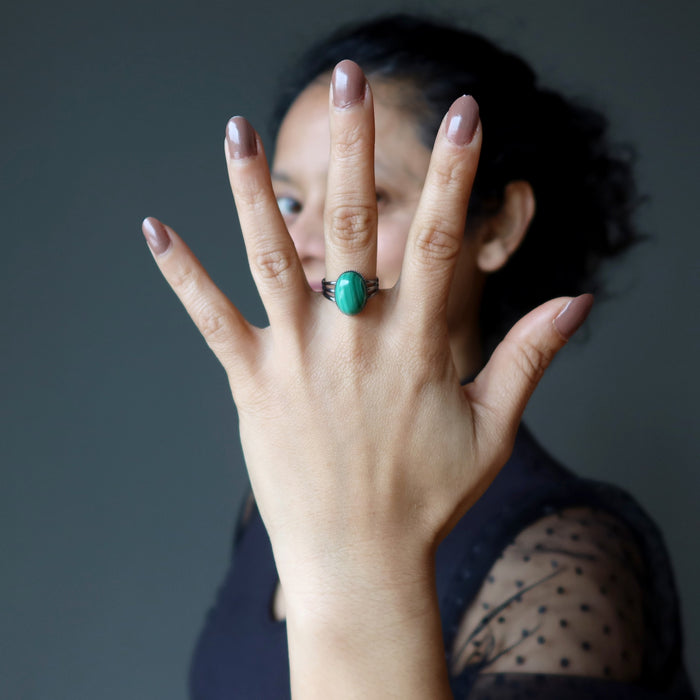 sheila of satin crystals wearing malachite gunmetal ring