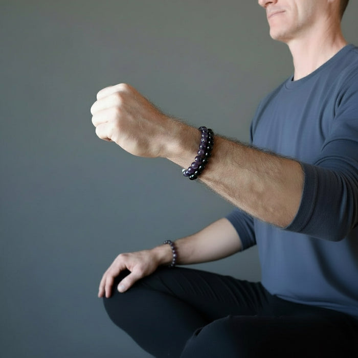 ryan of satin crystals wearing an amethyst and tourmaline bracelet set