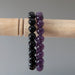 black tourmaline and amethyst bracelet set hanging on a stick