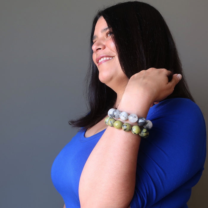 female modeling tourmaline quartz and serpentine bracelet set