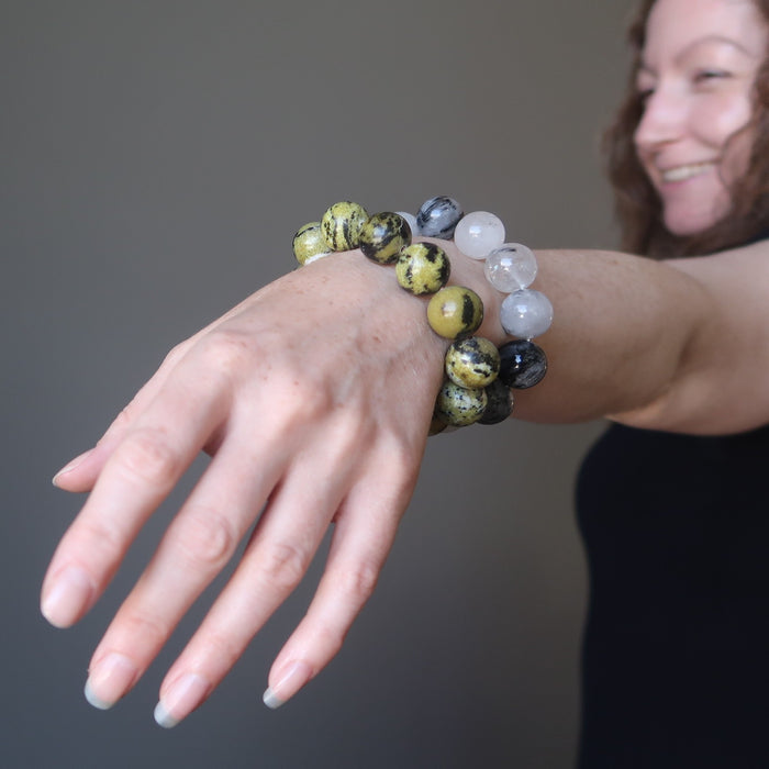female modeling tourmaline quartz and serpentine bracelet set