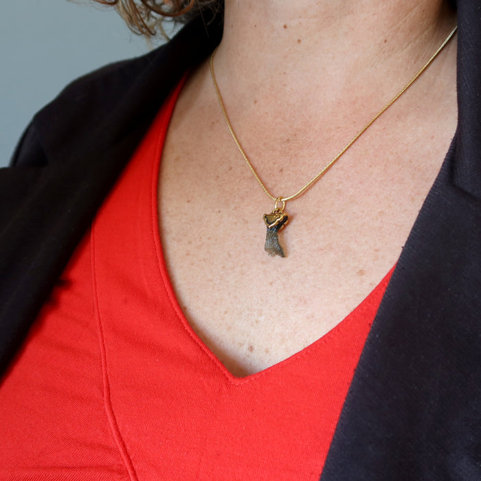 moldavite necklace on female model