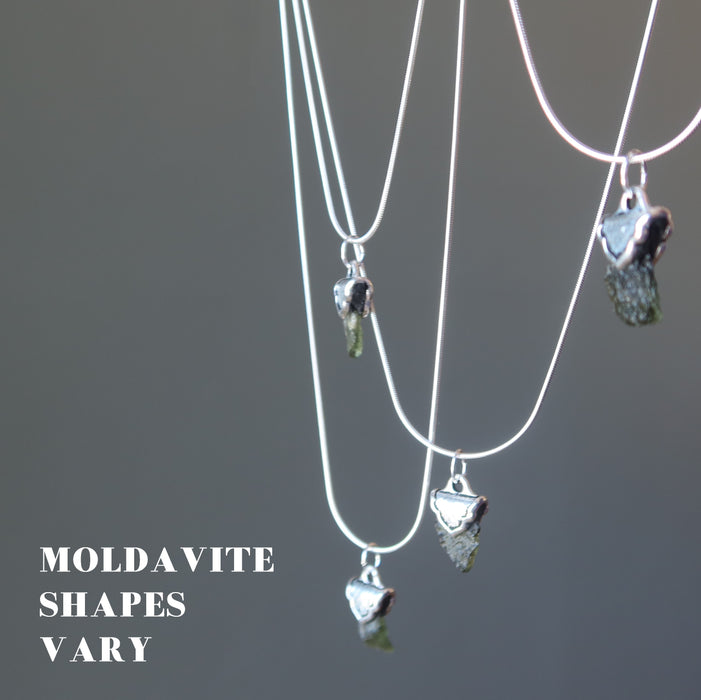 four moldavite necklaces showing moldavite shapes vary