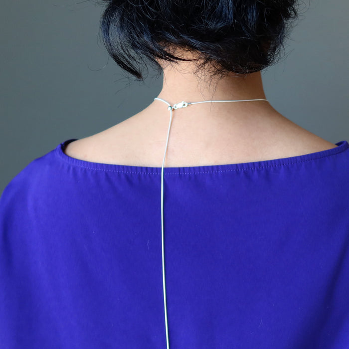 female wearing moldavite sterling silver necklace