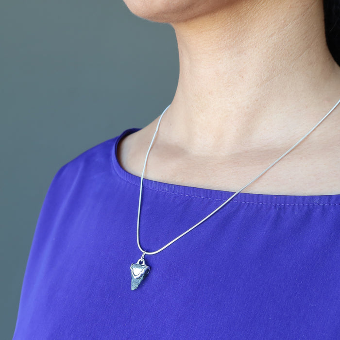 female wearing moldavite sterling silver necklace