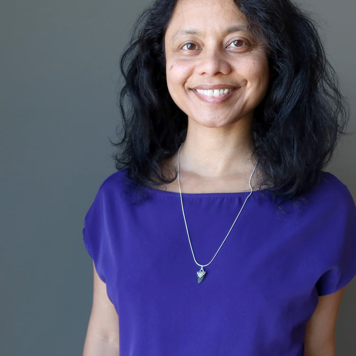 female wearing moldavite sterling silver necklace