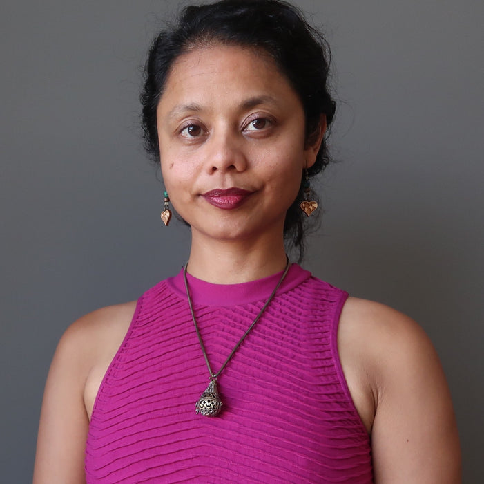 sheila of satin crystals wearing moldavite locket necklace