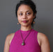 sheila of satin crystals wearing moldavite locket necklace
