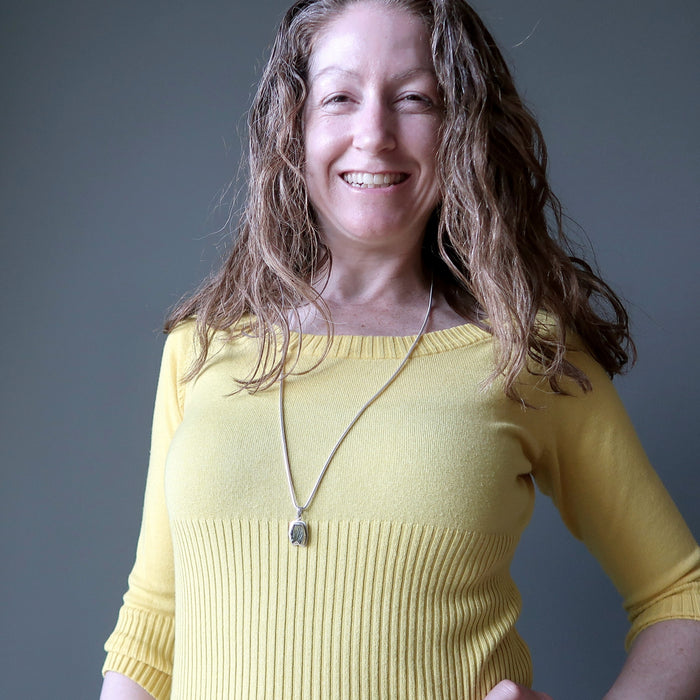 jamie of satin crystals wearing a moldavite necklace