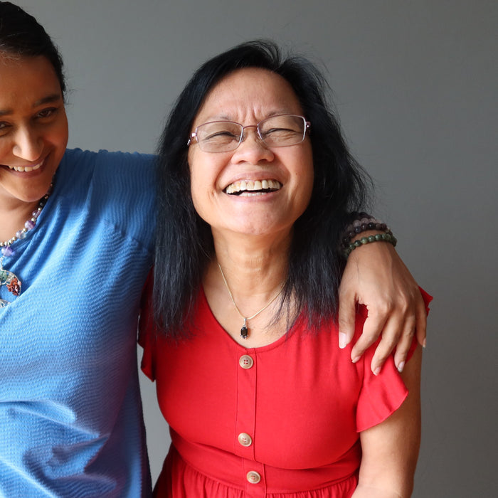 mother and daughter, mother wearing moldavite garnet pendant