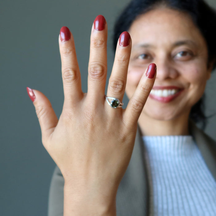 sheila of satin crystals wearing a moldavite faceted ring on her finger