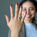 sheila of satin crystals wearing a moldavite faceted ring on her finger