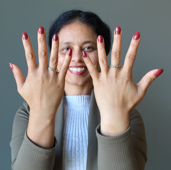sheila of satin crystals wearing moldavite rings