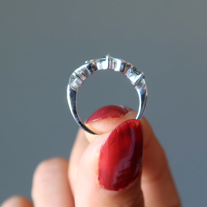 hand holding moldavite ring