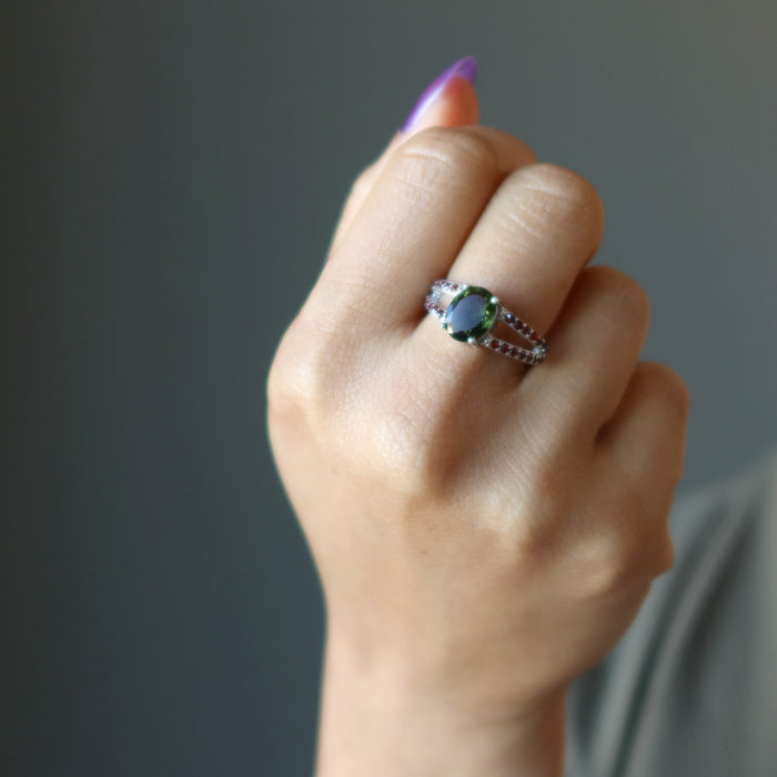 moldavite garnet ring on hand