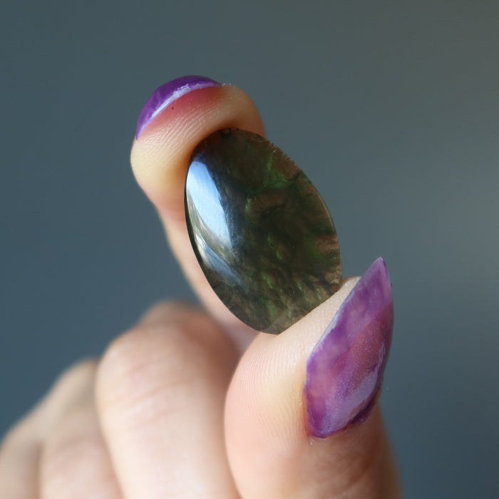 hand holding moldavite