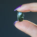 hand holding moldavite stone